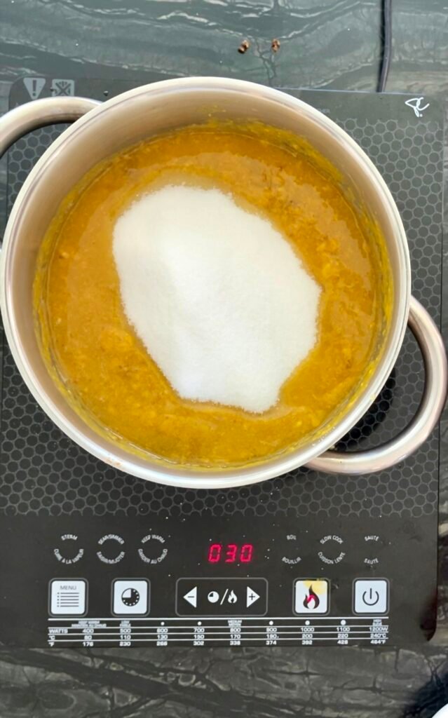 smooth mango chutney - add sugar to a pot with ingredients