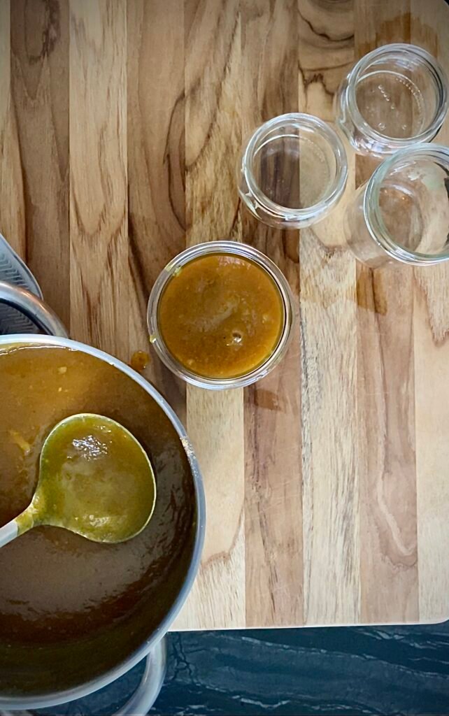 smooth mango chutney -pour into canning jars