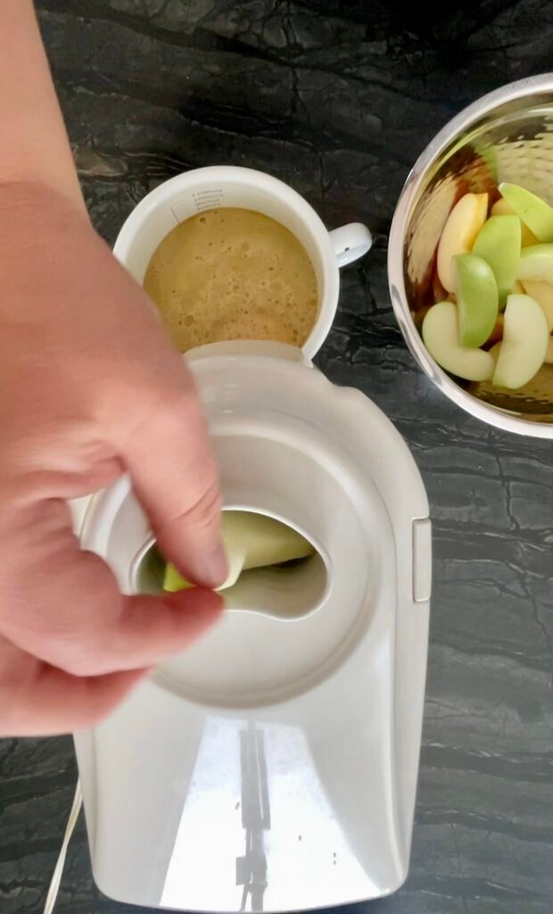 apple lemon balm jelly prep - we use juicer to juice apples for this homemade lemon balm jelly recipe