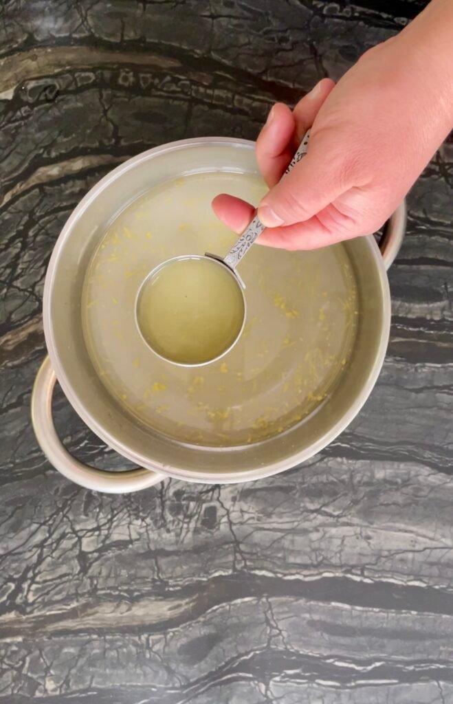 apple lemon balm - adding water and lemon juice to the pot