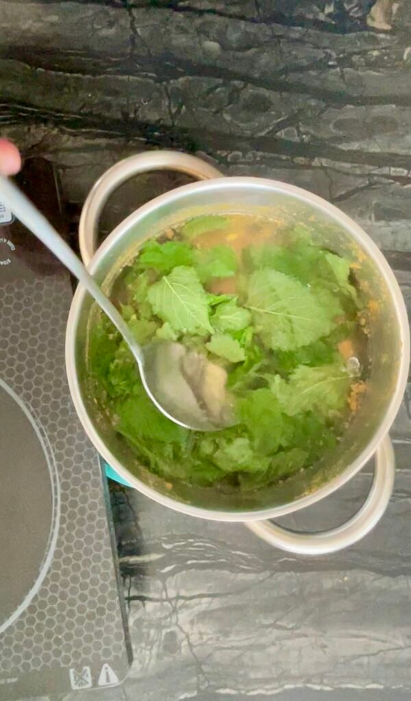apple lemon balm jelly -Lemon balm leaves added to hot apple juice off the heat.