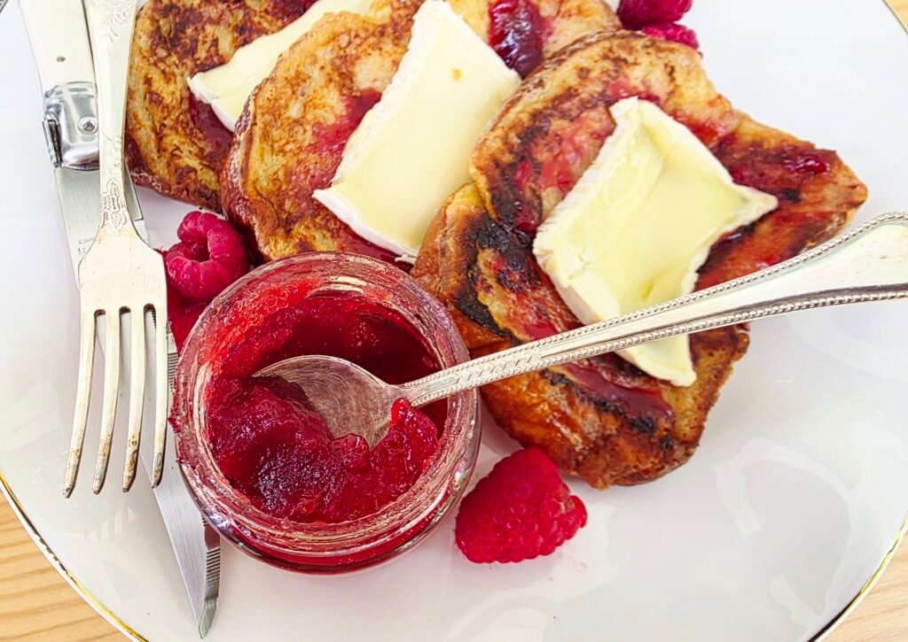 homemade seedless raspberry jam on a French toast 
