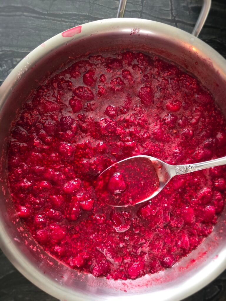 pot of macerated berries, juice pooled