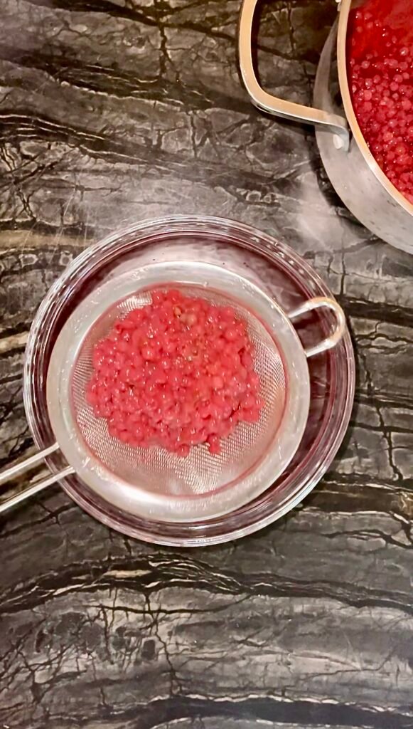 straining through a fine-mesh strainer
