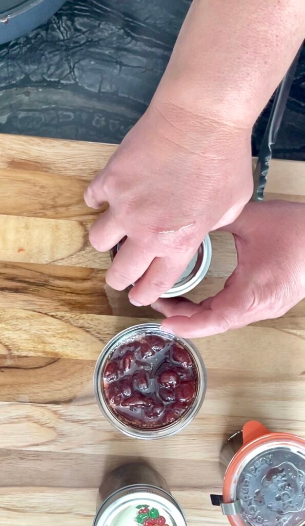 finished sour cherry jam in mason canning jars