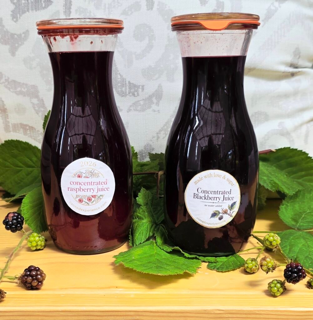 berry juice in WECK juice jars on a wooden table 
