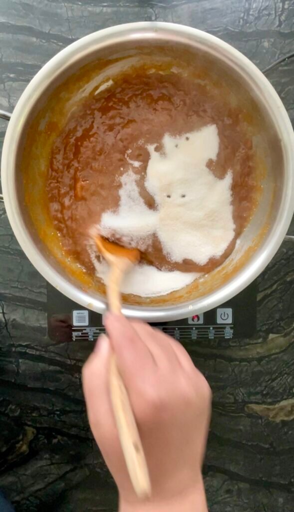 peach apricot jam: the pectin and remaining sugar stirred into the cooked fruit base