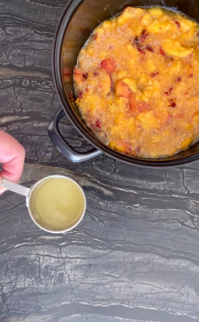 peach apricot lavender jam: measuring fresh lemon juice to add with the apricots and lavender