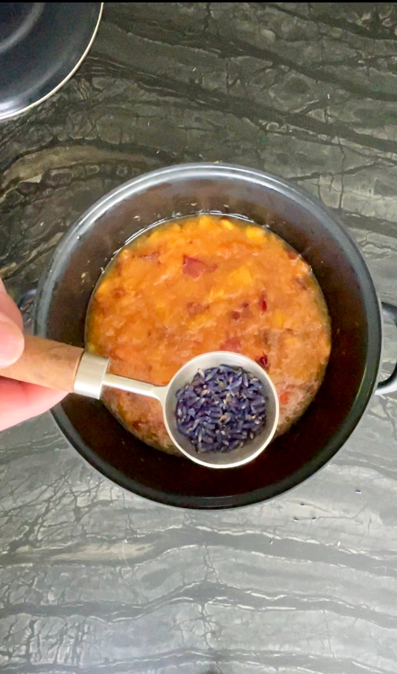 peach apricot lavender jam: adding dried culinary lavender buds during the second mash, with the apricots and lemon juice